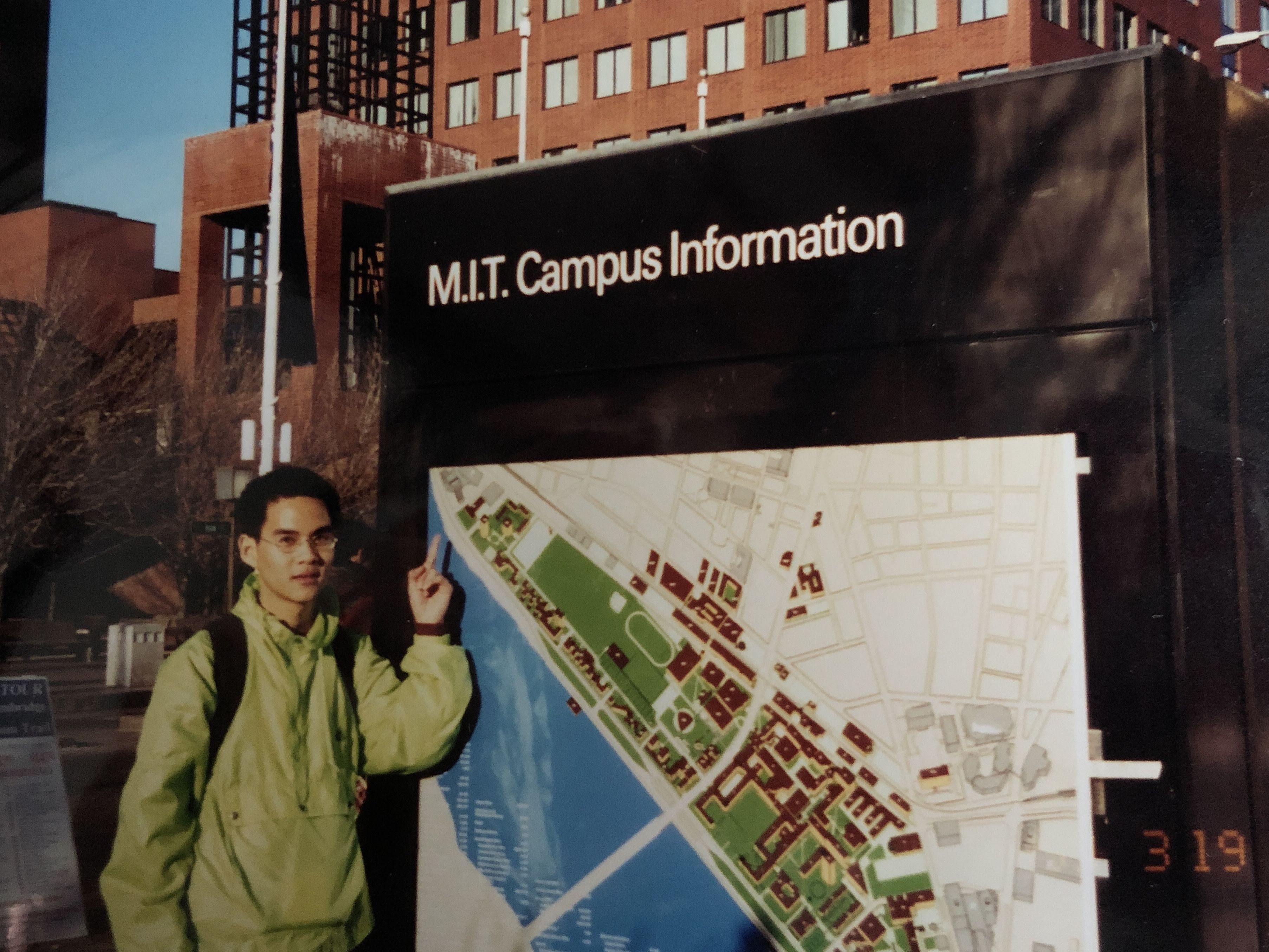 Non pointing at the MIT Campus Information sign — his first day at MIT, Boston, winter